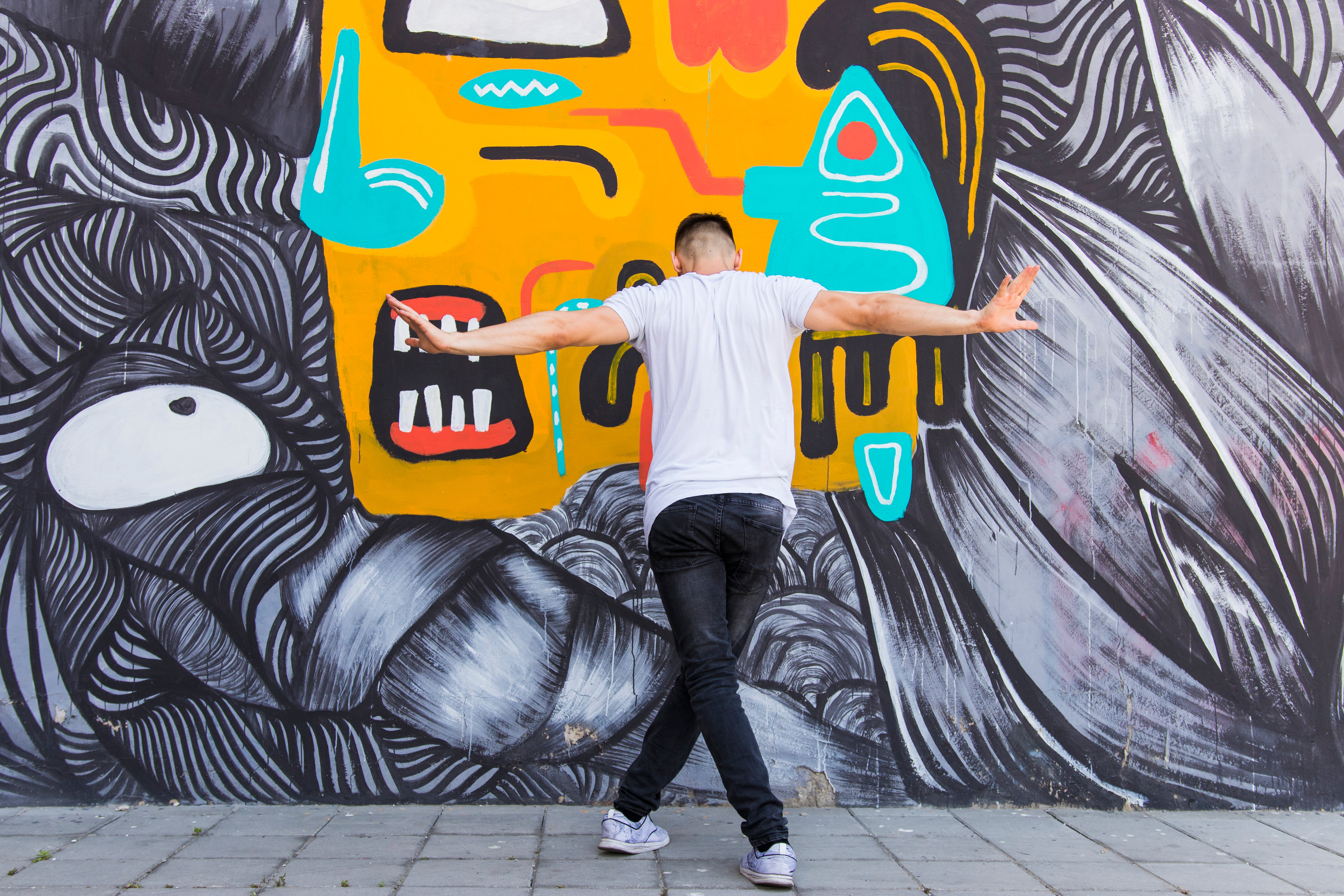 rear-view-man-dancing-creative-wall-backdrop.jpg